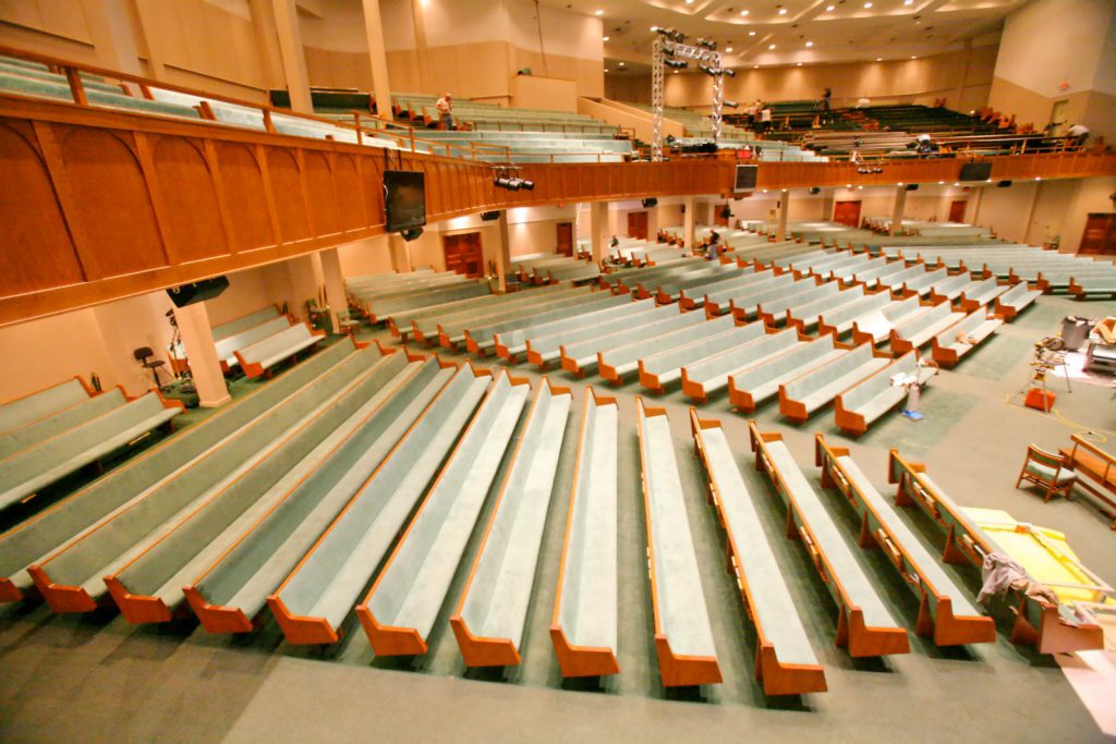 upholstered church pews in sanctuary