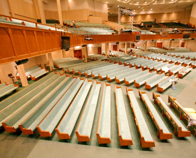 upholstered church pews in sanctuary