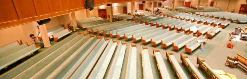 upholstered church pews in sanctuary